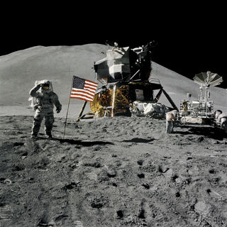 Apollo 15 Lunar Module Pilot James Irwin salutes the U.S. flag.