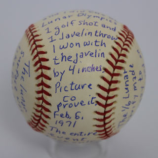Baseball written on and signed by Edgar Mitchell, Apollo 14 astronaut.
