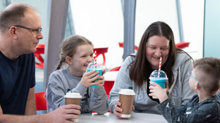 Family enjoying milkshakes and coffees in Boosters cafe