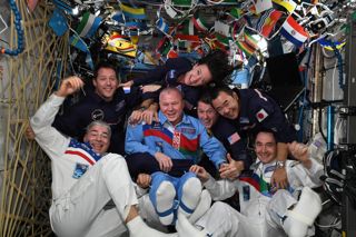 Astronauts onboard the ISS celebrating the 2020 Tokyo Olympics.