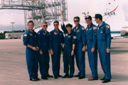 The crew of mission STS 78 with the Atlanta Olympic torch in 1996.