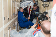 The Olympic Torch for the 2014 Winter Olympics arrives onboard the ISS.